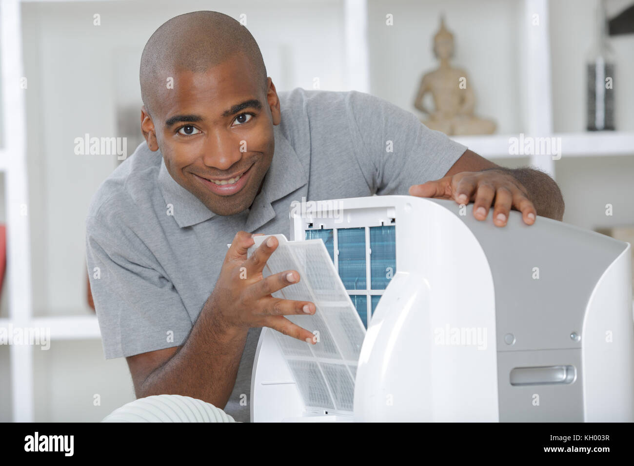 Man with mobile air conditioning unit Stock Photo Alamy