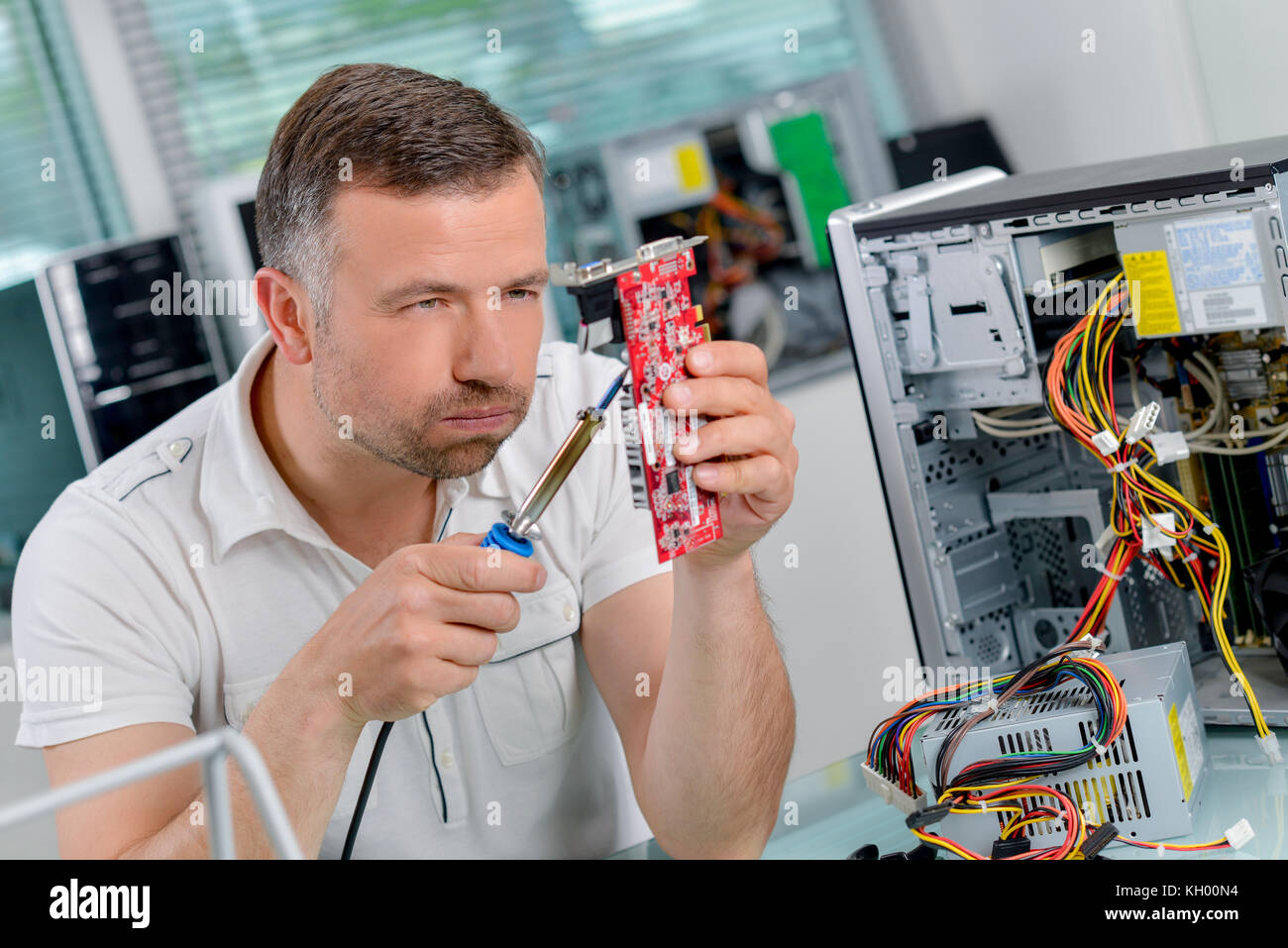 Fixing a computer Stock Photo Alamy