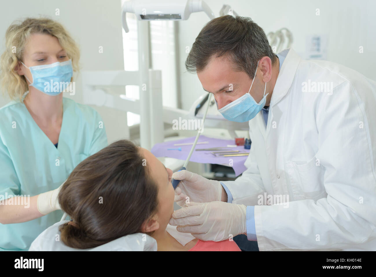 dentist assistant and patient at stomatology office Stock Photo