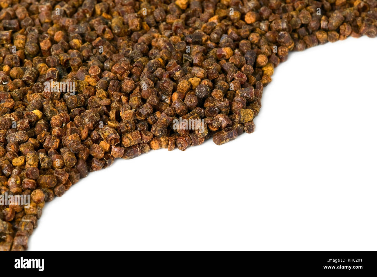 Propolis granules on white background, bee product, frame composition Stock Photo