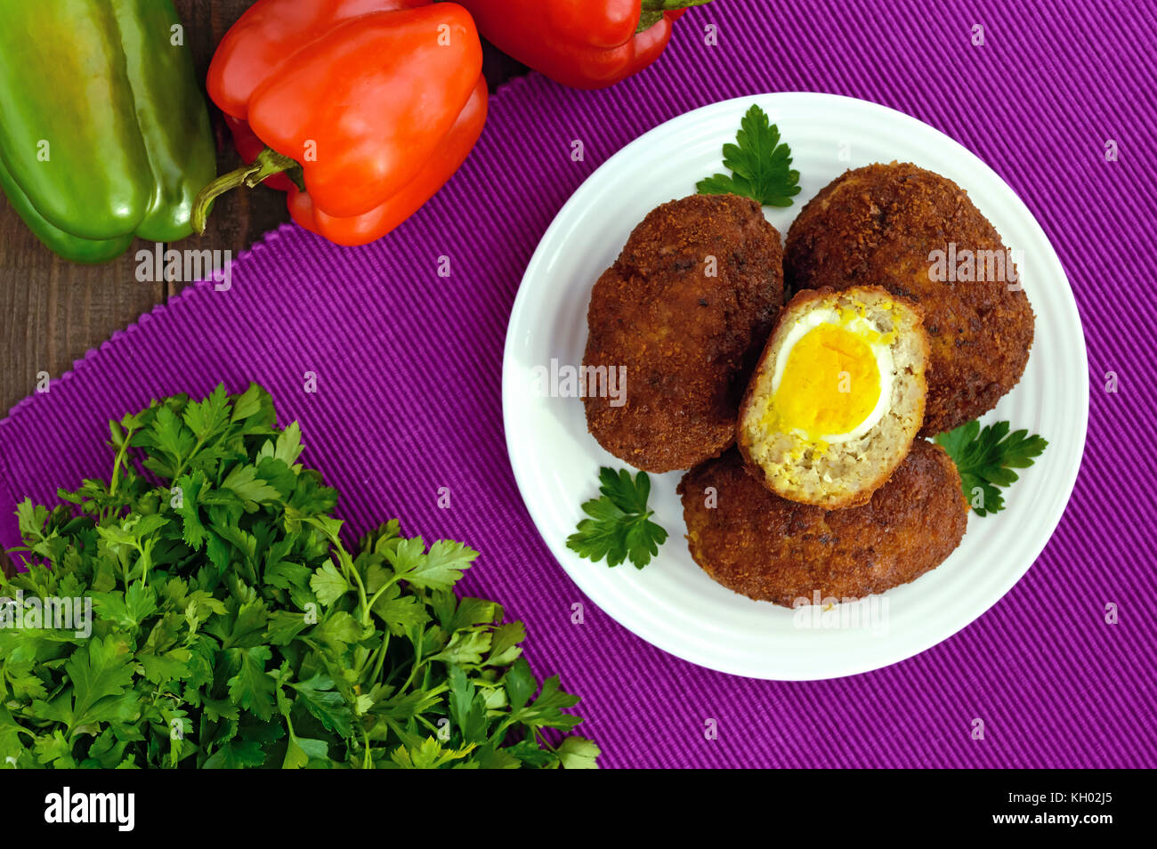Meat mini-rolls (cutlet) with boiled egg. The top view Stock Photo - Alamy