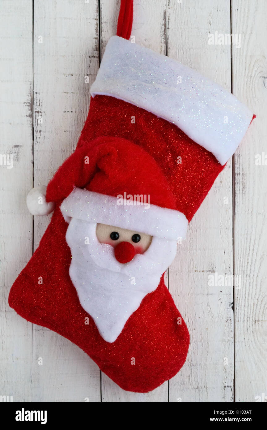 Red Christmas boots with textile head of Santa Claus on a white background  Stock Photo - Alamy