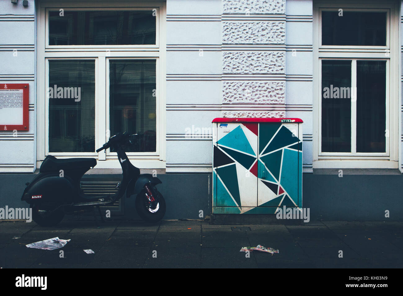 cool hipster street art graffiti next to moped bike Stock Photo