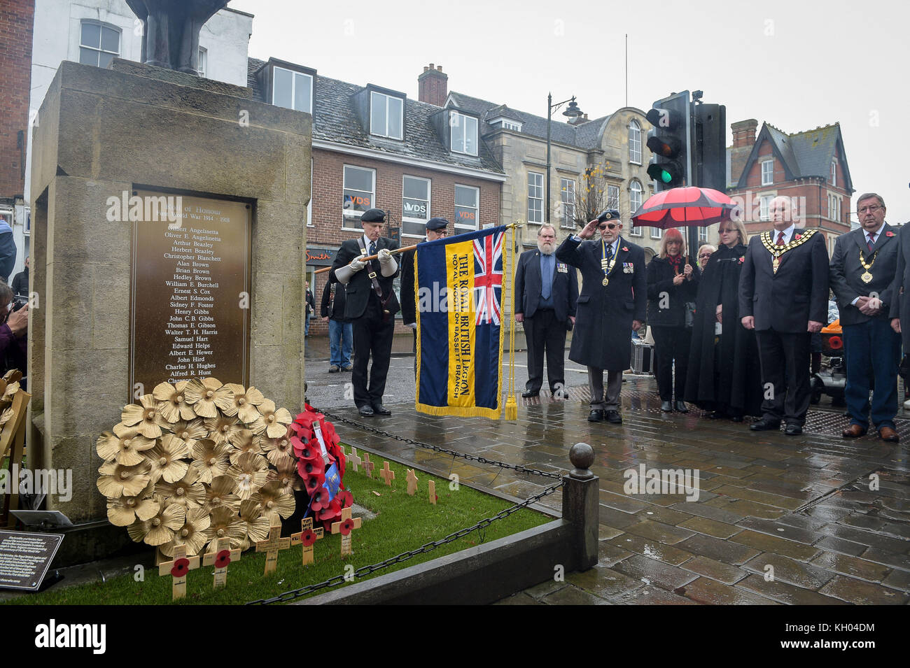 The Royal British Legion standard is lowered at the war memorial during