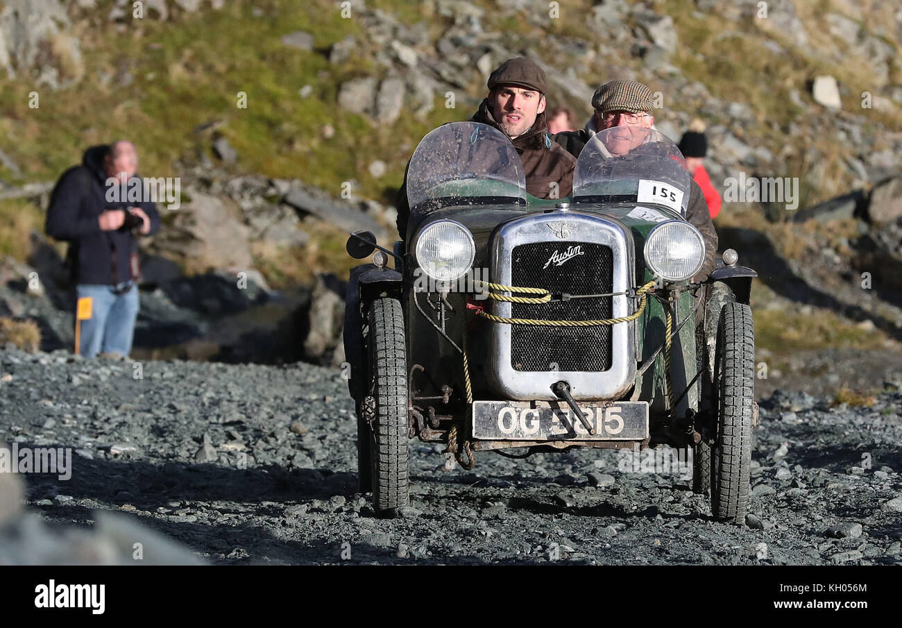 A 1930 Austin 7 driven by Anthony Maitland, is driven along the quarry road at Honister Slate Mine, in Borrowdale, Keswick, Cumbria, during the annual Lakeland Trials vintage car rally. Stock Photo