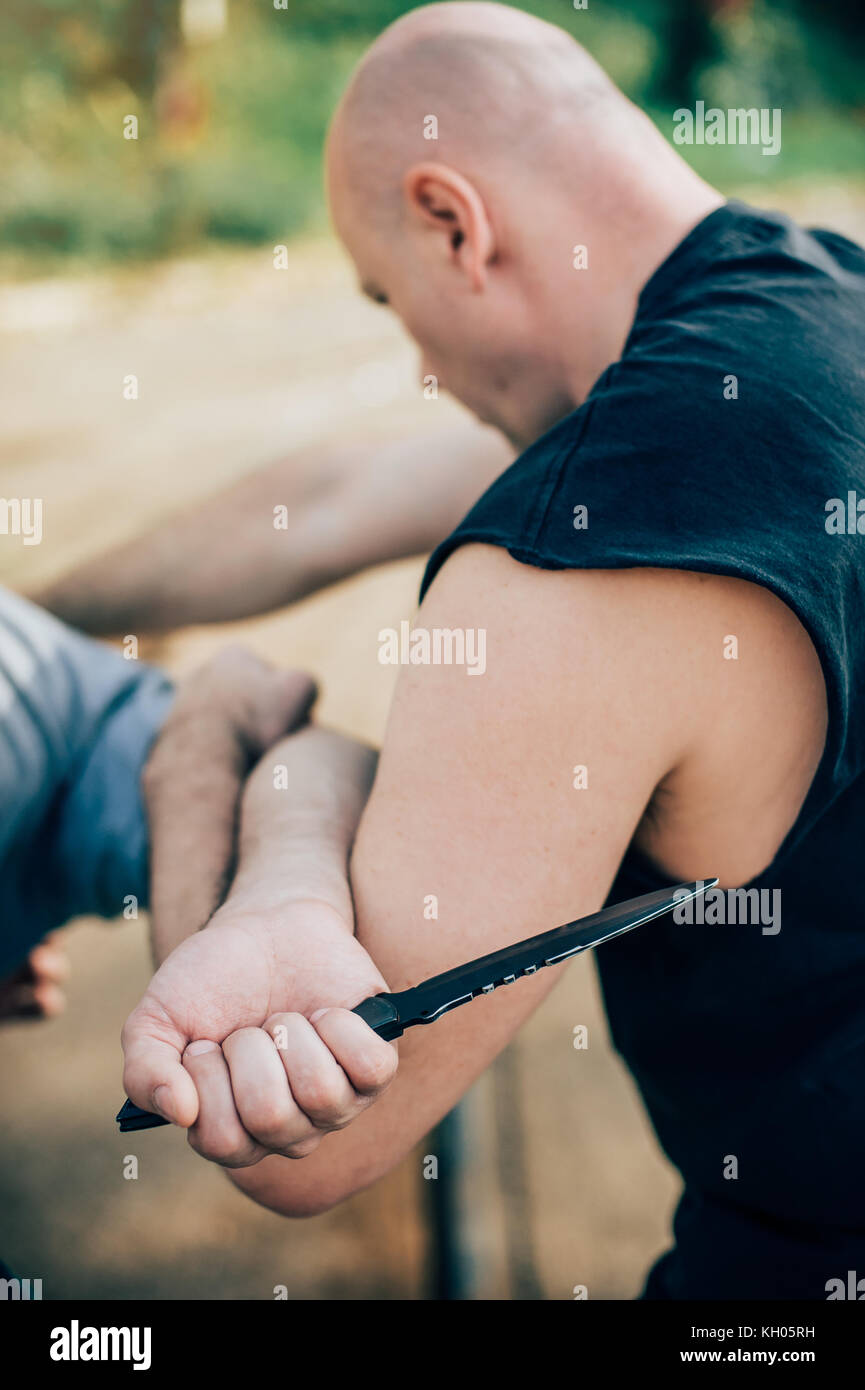 Kapap instructor demonstrates martial arts self defense knife attack