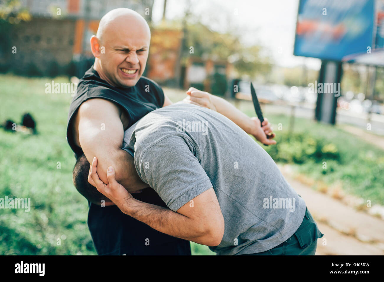 Kapap Instructor Demonstrates Martial Arts Self Defense Knife Attack Disarming Technique Against Threat And Knife Attack Weapon Retention And Disarm Stock Photo Alamy