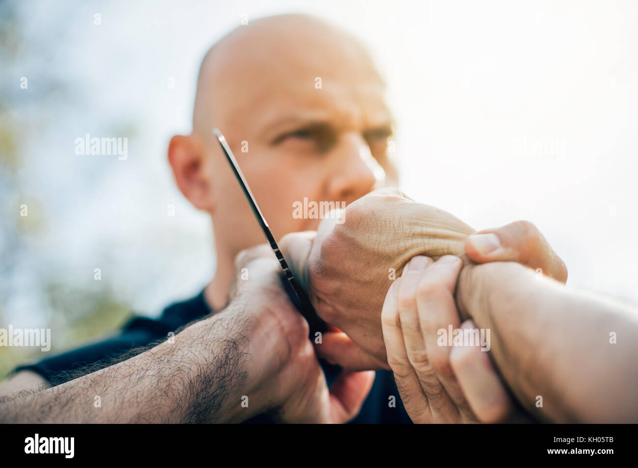 Kapap Instructor Demonstrates Martial Arts Self Defense Knife Attack Disarming Technique Against Threat And Knife Attack Weapon Retention And Disarm Stock Photo Alamy