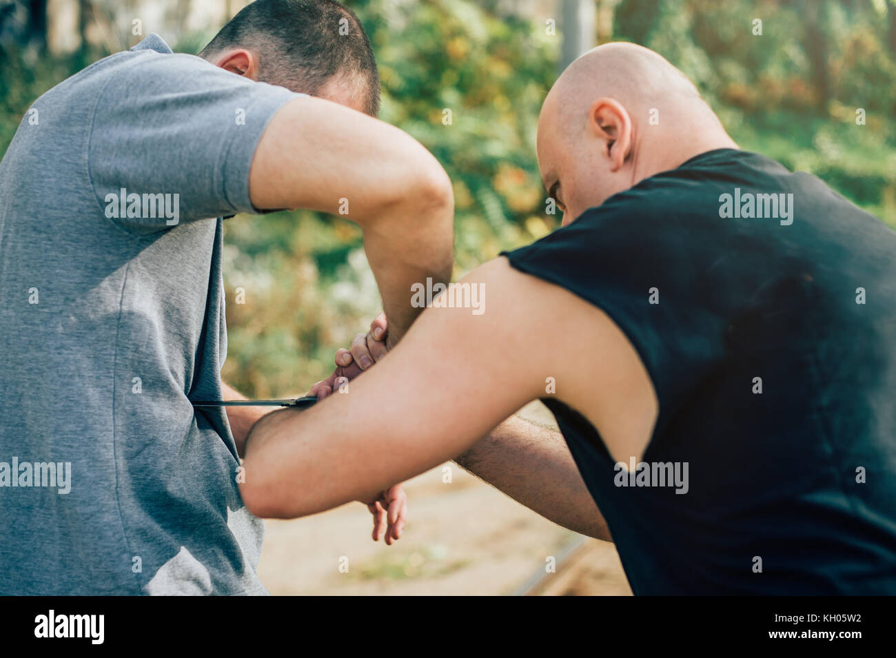 Kapap instructor demonstrates martial arts self defense knife attack