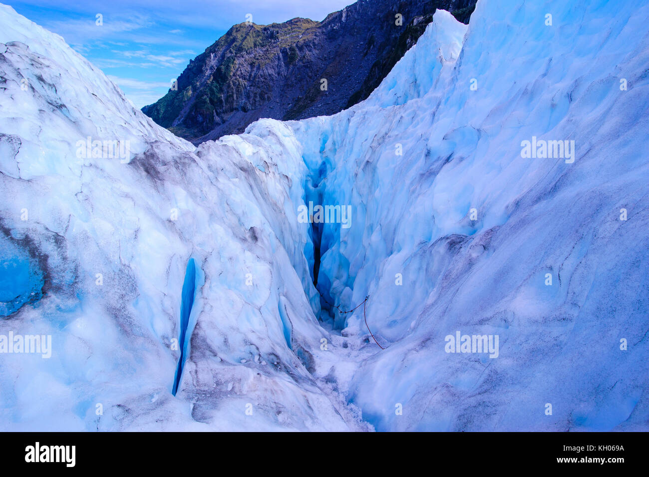 Entrance to an ice cave, Fox Glacier, South Island, New Zealand Stock Photo