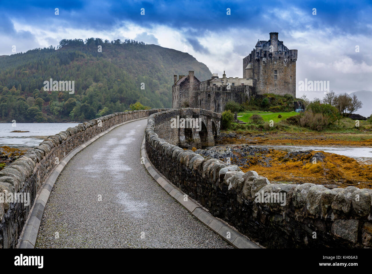 The bridge to Eilean Donan, a 13th century restored island castle at the junction of Lochs Duich, Long and Alsh near Kyle of Lochalsh, Scotland, UK Stock Photo