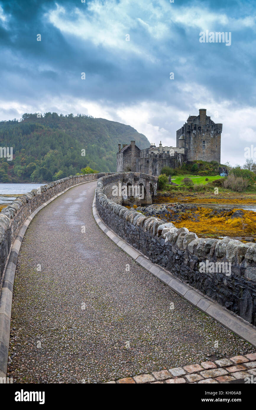 The bridge to Eilean Donan, a 13th century restored island castle at the junction of Lochs Duich, Long and Alsh near Kyle of Lochalsh, Scotland, UK Stock Photo