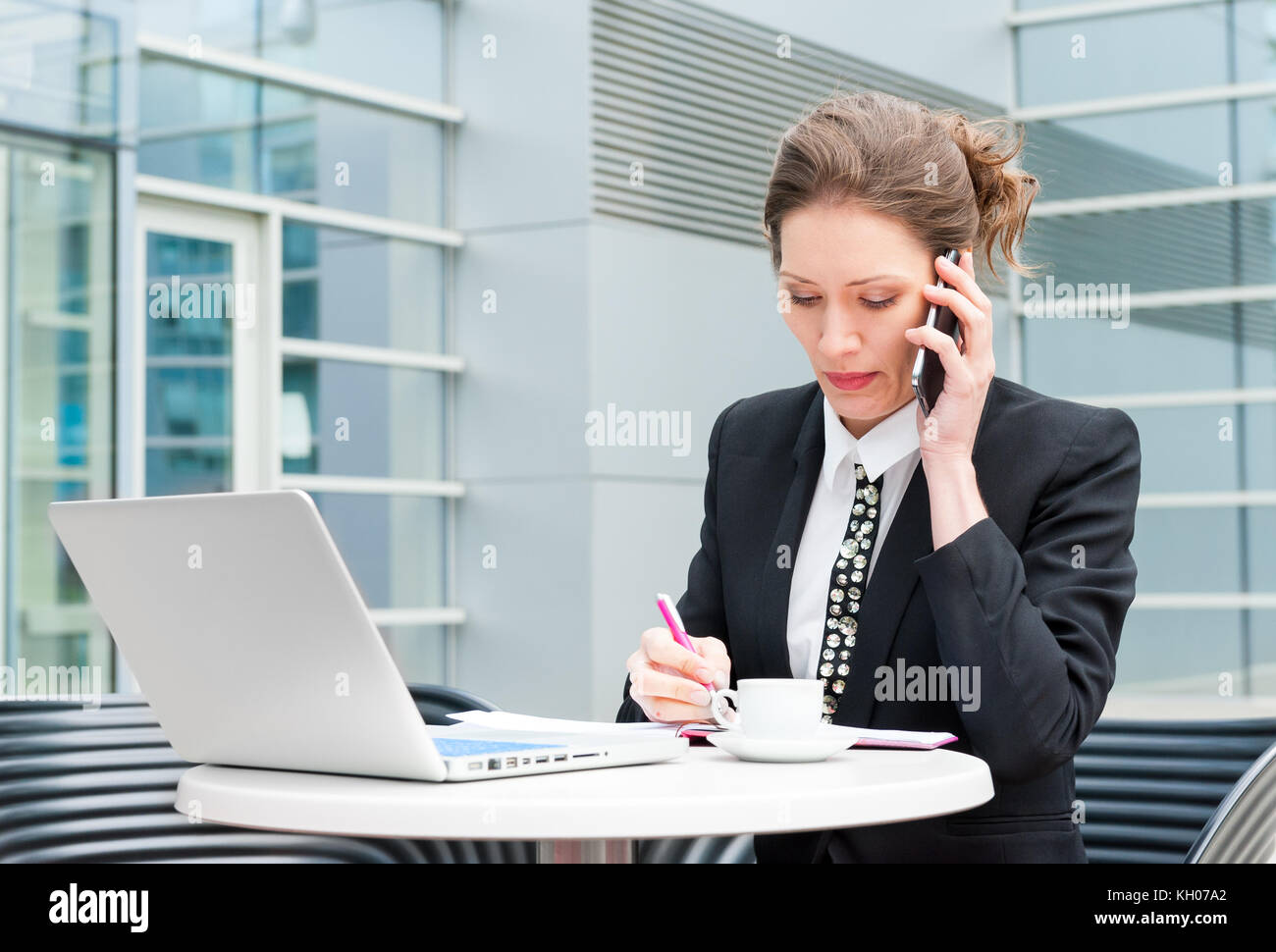 Young business woman working Stock Photo - Alamy