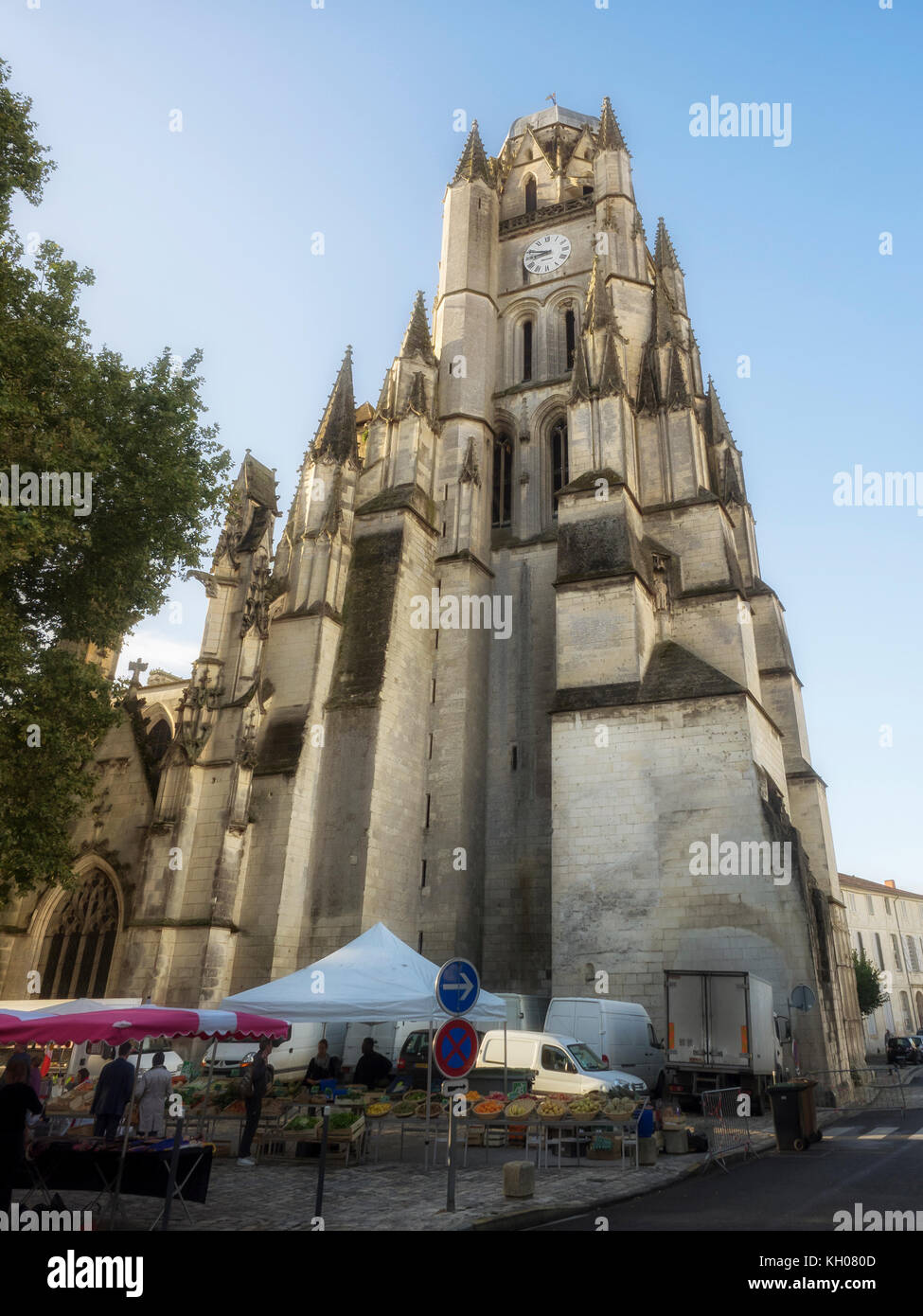 SAINTES, FRANCE:  Market Stalls at the foot of Saintes Cathedral (Cathédrale Saint-Pierre) Stock Photo