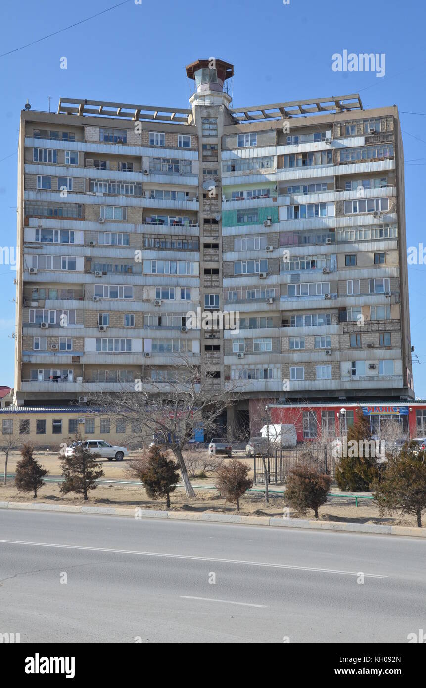 old low cost soviet union style Khrushchyovka apartment building, numbered, in Aktau, Kazakhstan. Stock Photo