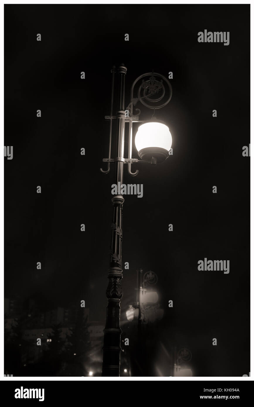 Foggy Night. Lonely Abstract Lamp post, Stock Photo