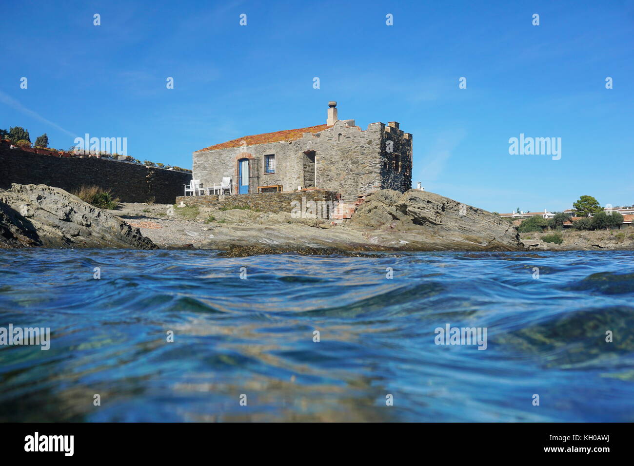 Old stony house on the seashore of the Mediterranean sea, Cadaques, Costa Brava, Catalonia, Spain Stock Photo