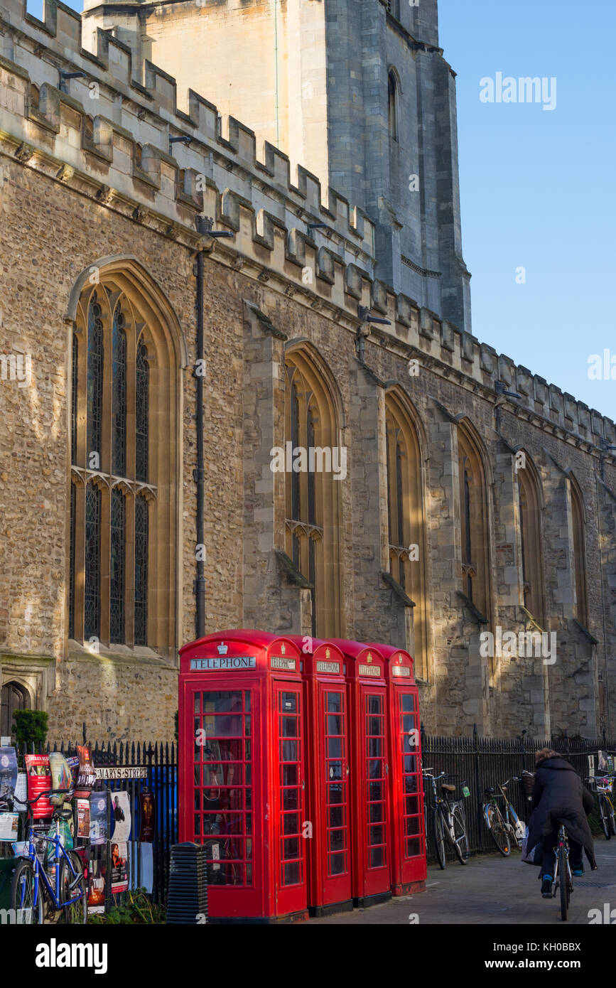 Traditional red British telephone boxes by Great Saint Mary church in the University city of Cambridge, UK. Stock Photo
