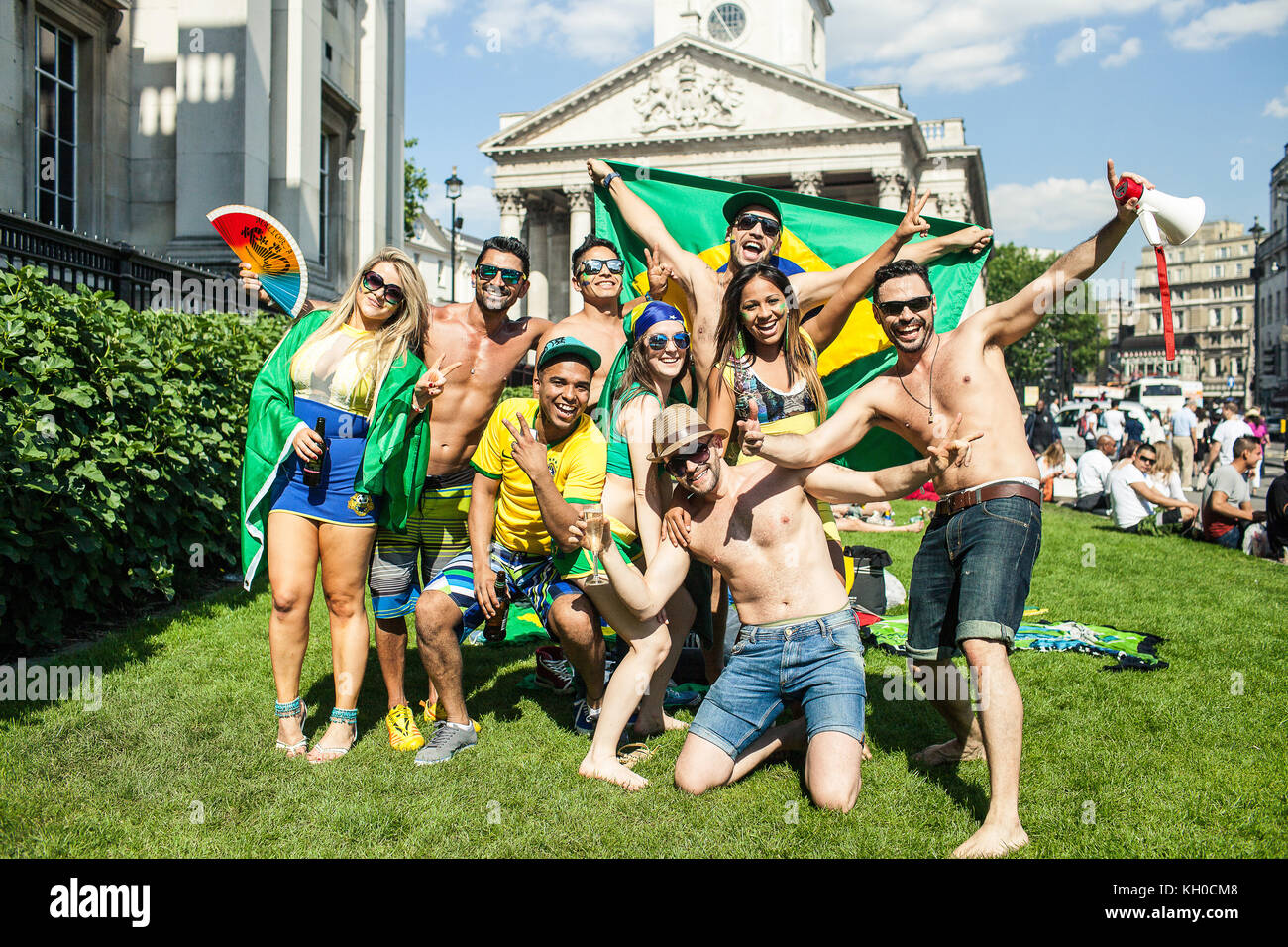 People from the Brazilian community are having a great time attending the ’Brazil Day’ at Trafalgar Square where they warm up for tonigh’s game between Brazil and Croatia at the FIFA World Cup 2014. UK 12/06 2014. Stock Photo