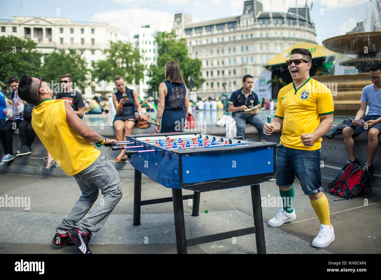 It seems obvious who wins and loses this game of table football. Doesn’t matter, they are both from Brazil. UK 12/06 2014. Stock Photo