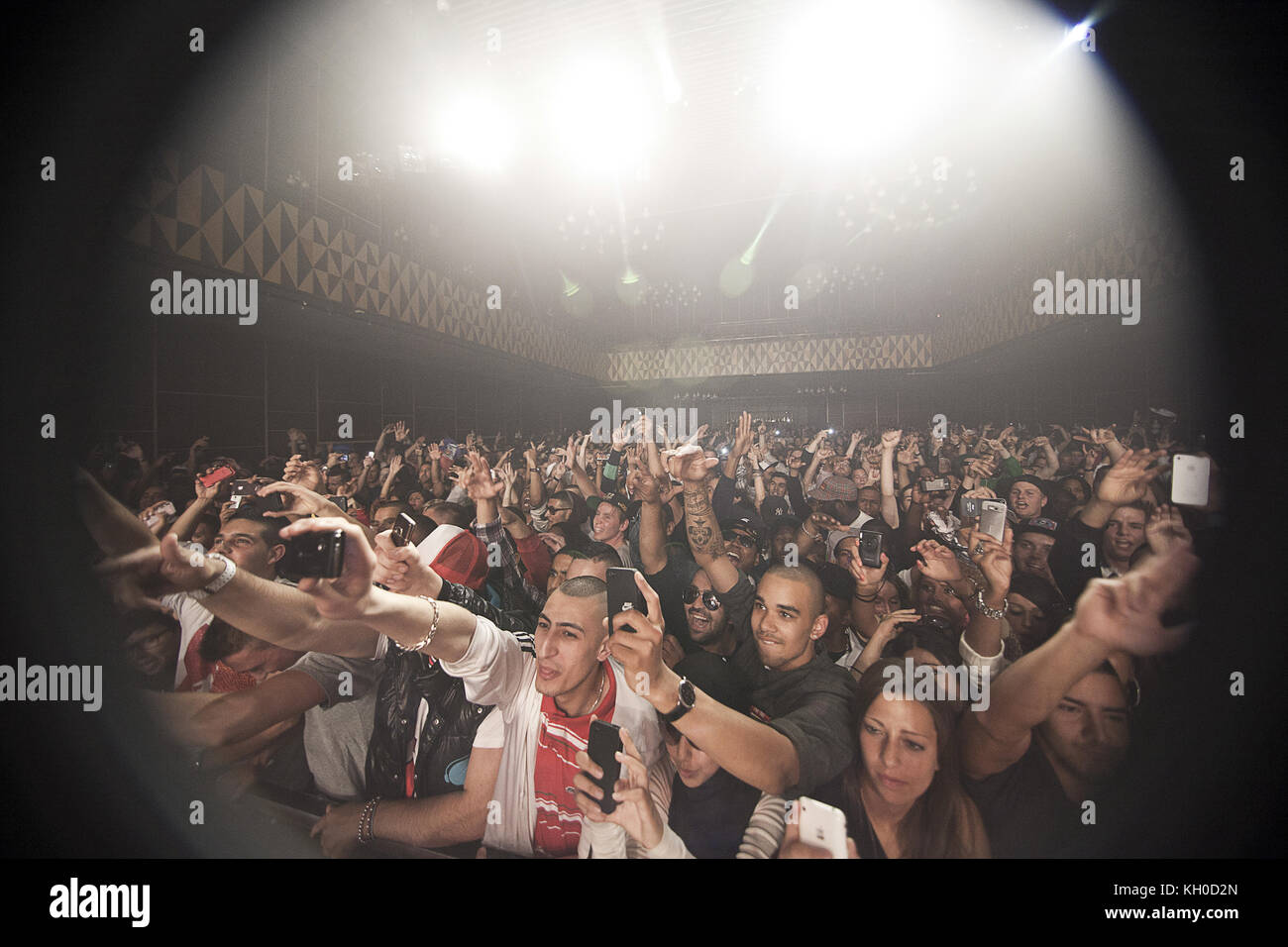 Energetic music fans take photos of the American rapper Rick Ross who ...