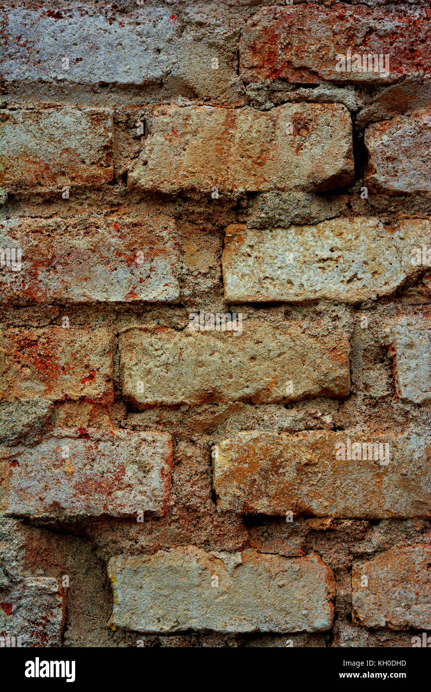Closeup detail photograph of a crumbling brick wall. Stock Photo
