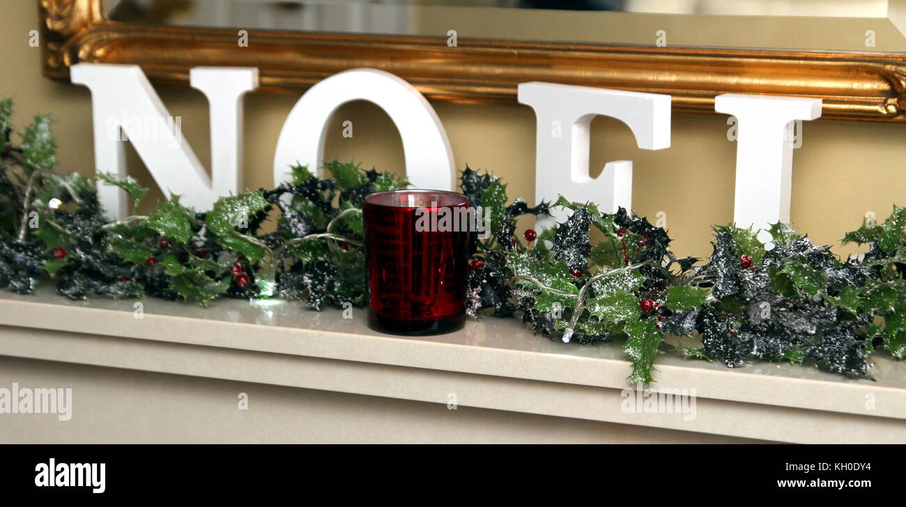 The Word Noel Spelled In Large Letters On A Lovely Mantlepiece