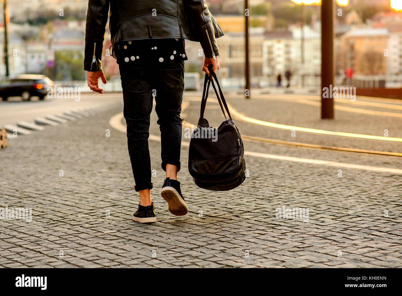 Close up look of the clothes and style of a man on the street in the sunset Stock Photo