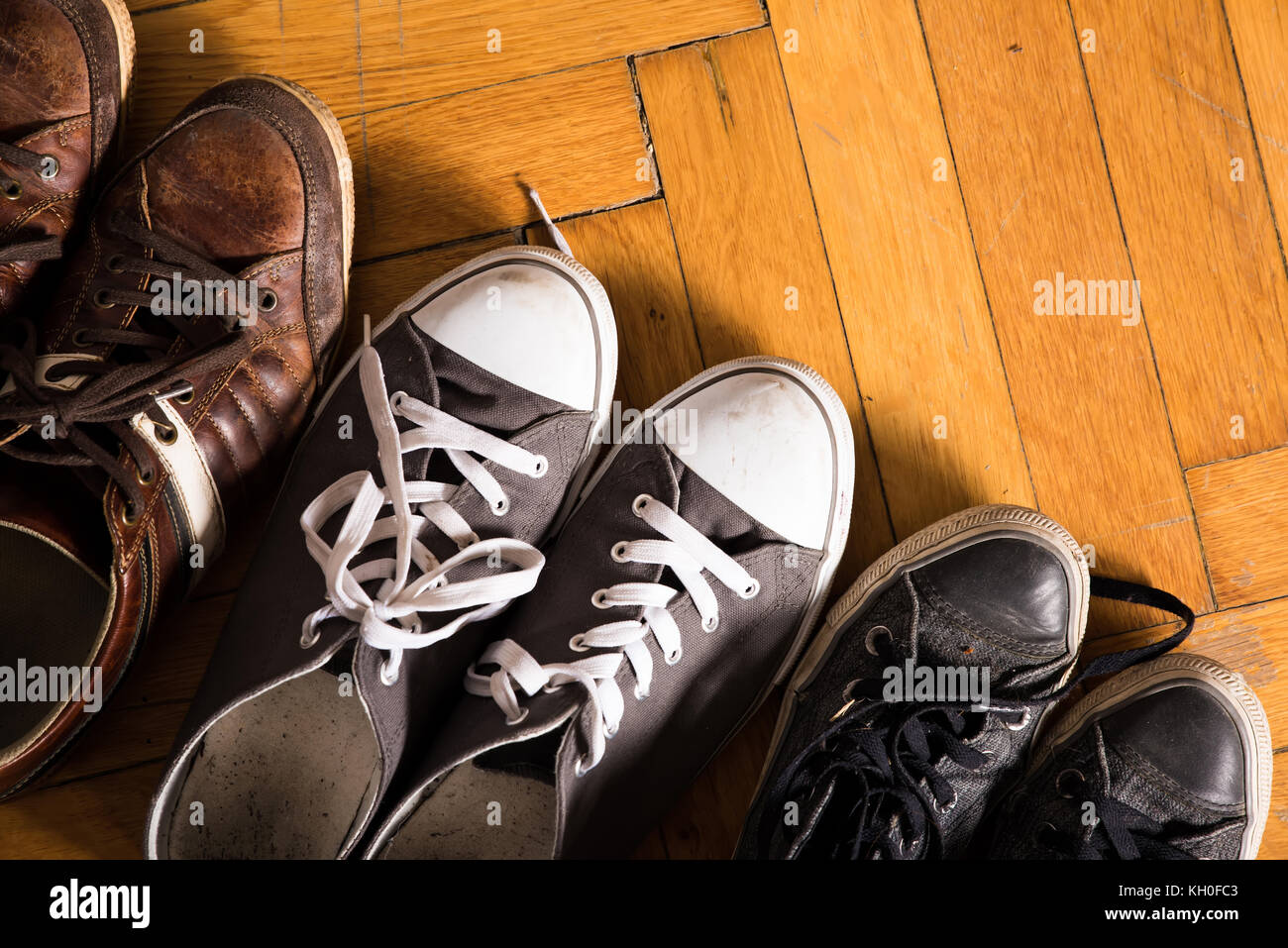 Some used sneakers on the floor Stock Photo - Alamy