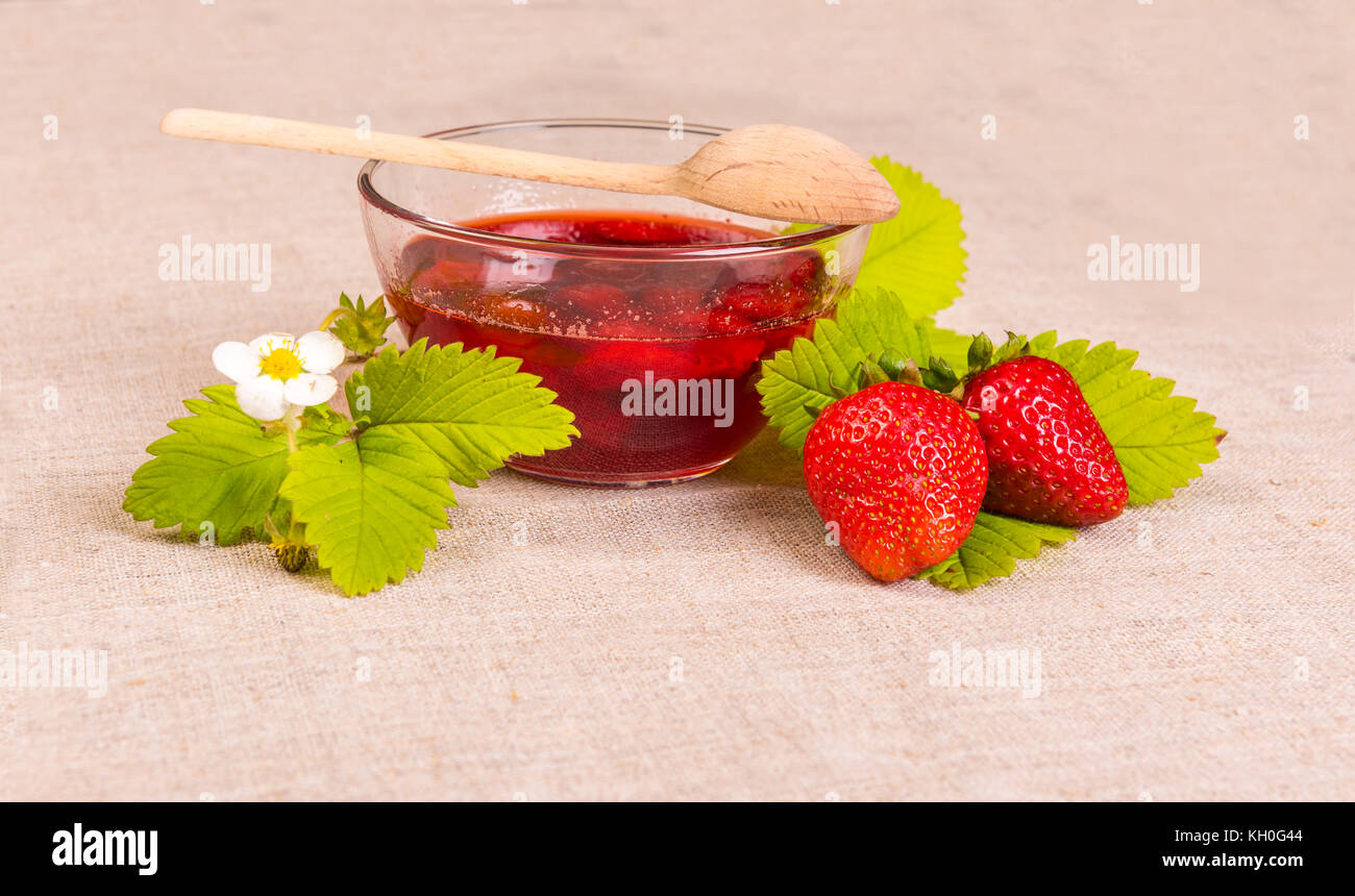 Fresh red strawberry and jam on textile background Stock Photo - Alamy