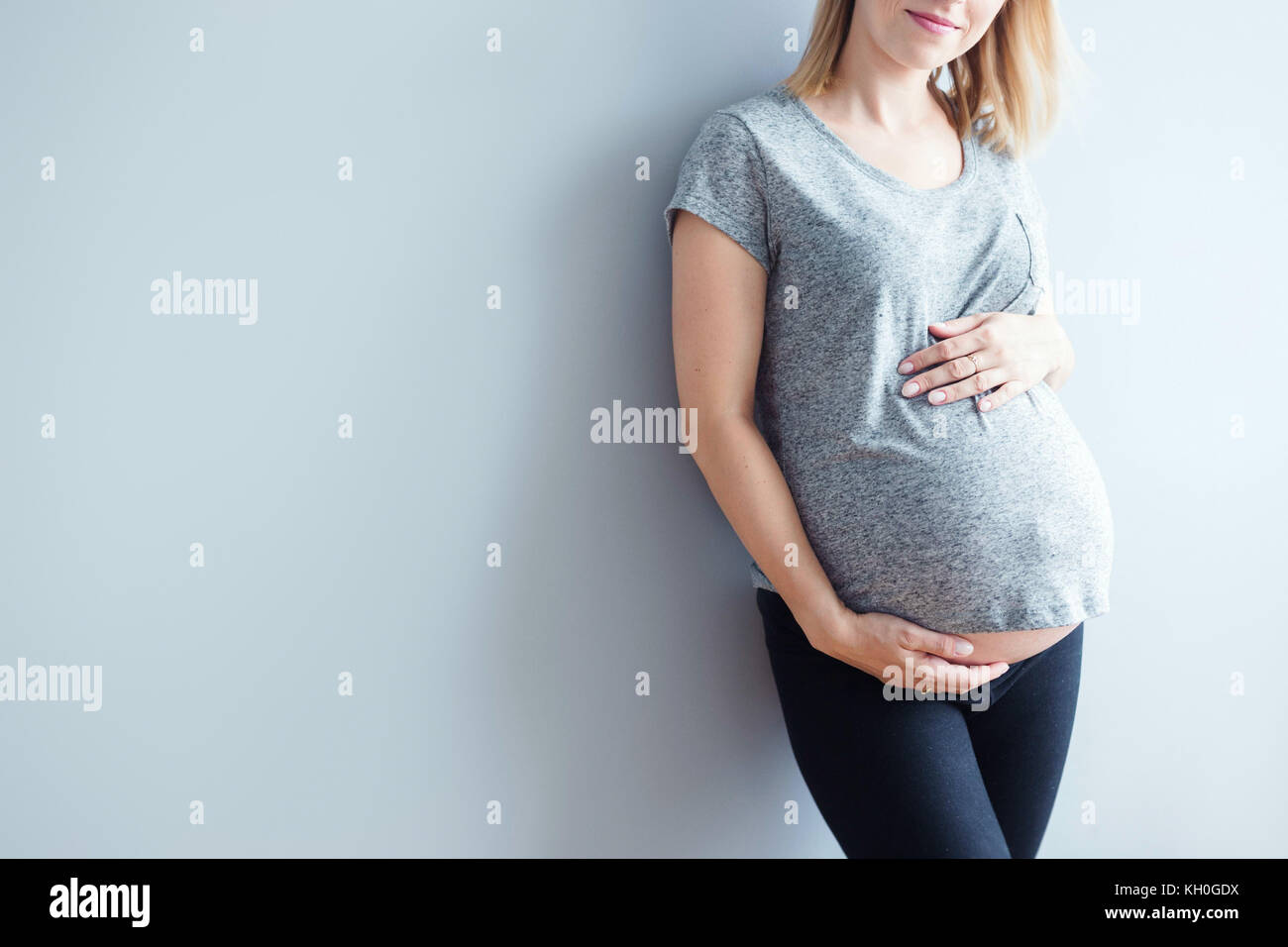 Blonde pregnant female standing hi-res stock photography and images - Alamy