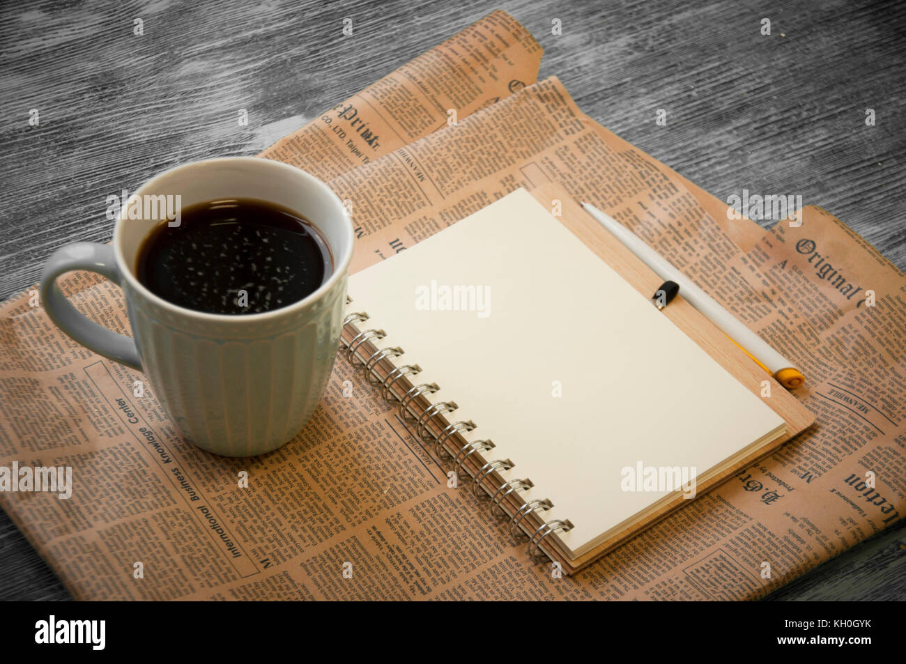 notebook, coffee beans, cup of cofee and newspaper Stock Photo Alamy