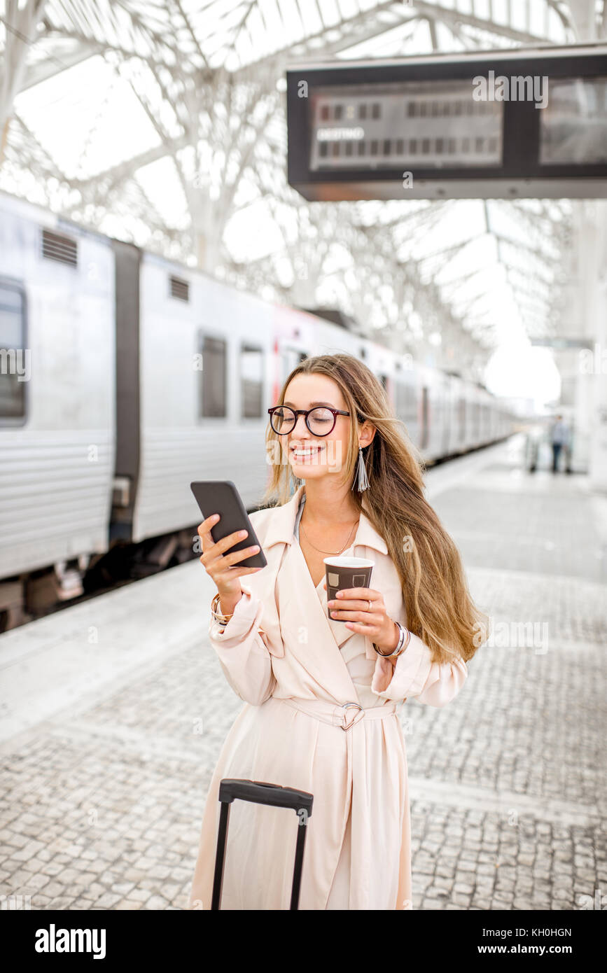 Woman at the railway station Stock Photo - Alamy