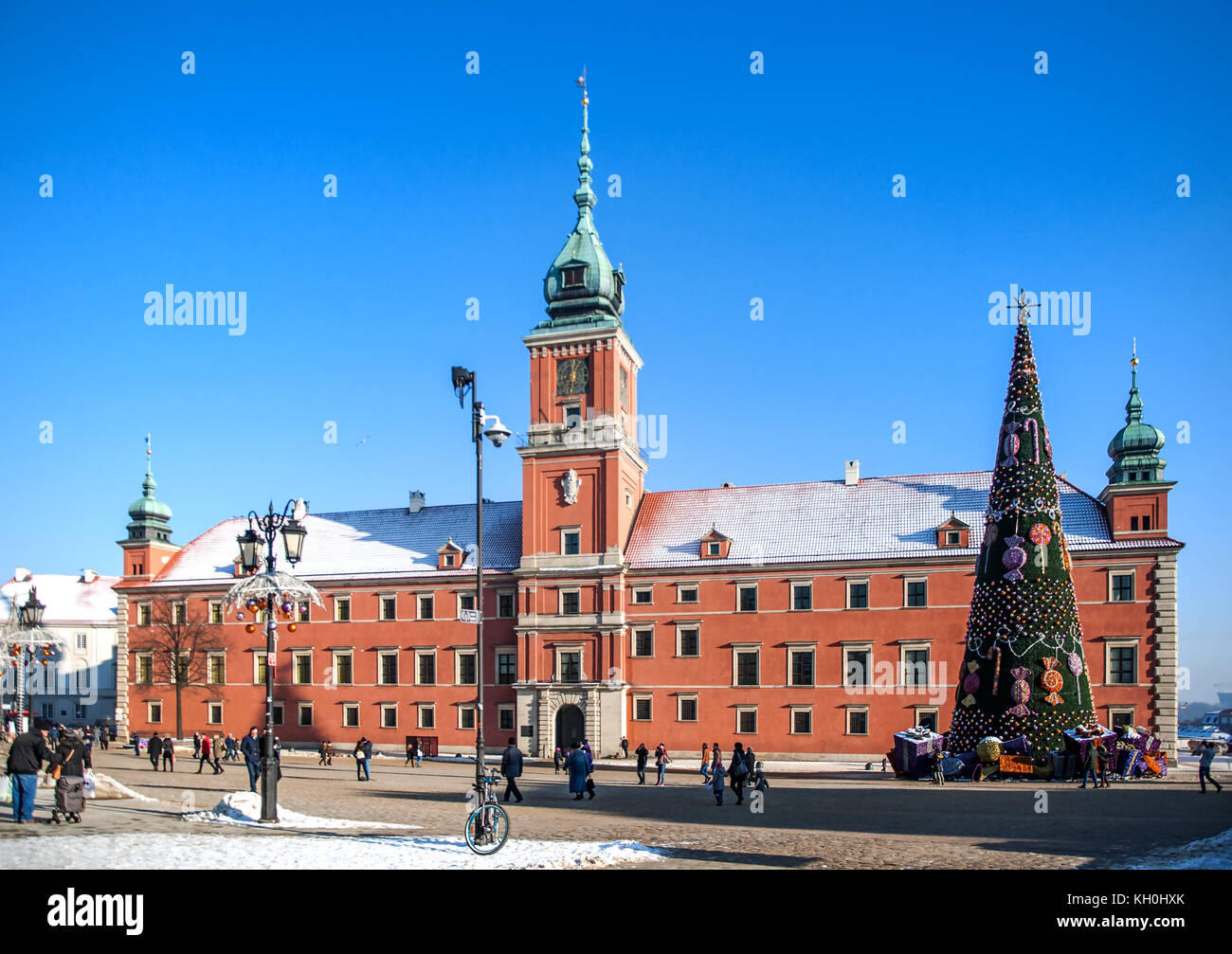 WARSZAWA, POLAND - JANUARY 23, 2016: Royal Castle in Warsaw, Poland,  in winter, with Christmas tree, gifts, presents and walking people Stock Photo