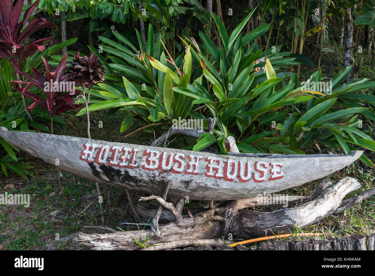 Sign of Hotel Bush House on a traditional dugout canoe. Madagascar, Africa Stock Photo