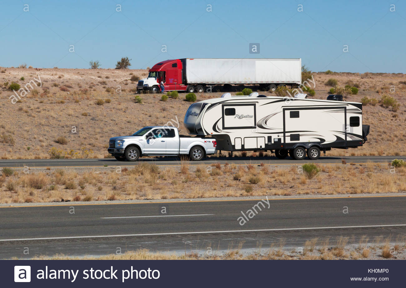 Pickup truck pulling fifth wheel travel trailer in southeastern Stock