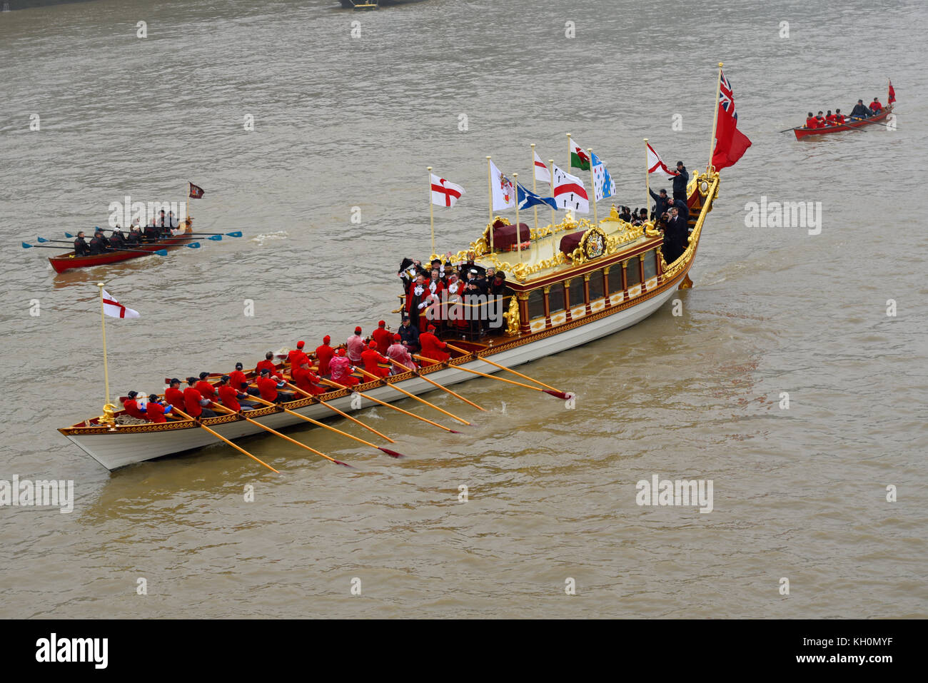 London’s new Lord Mayor Charles Bowman travelled aboard the Queen’s Rowbarge Gloriana accompanied by a flotilla of traditional Thames boats on River Thames London Stock Photo