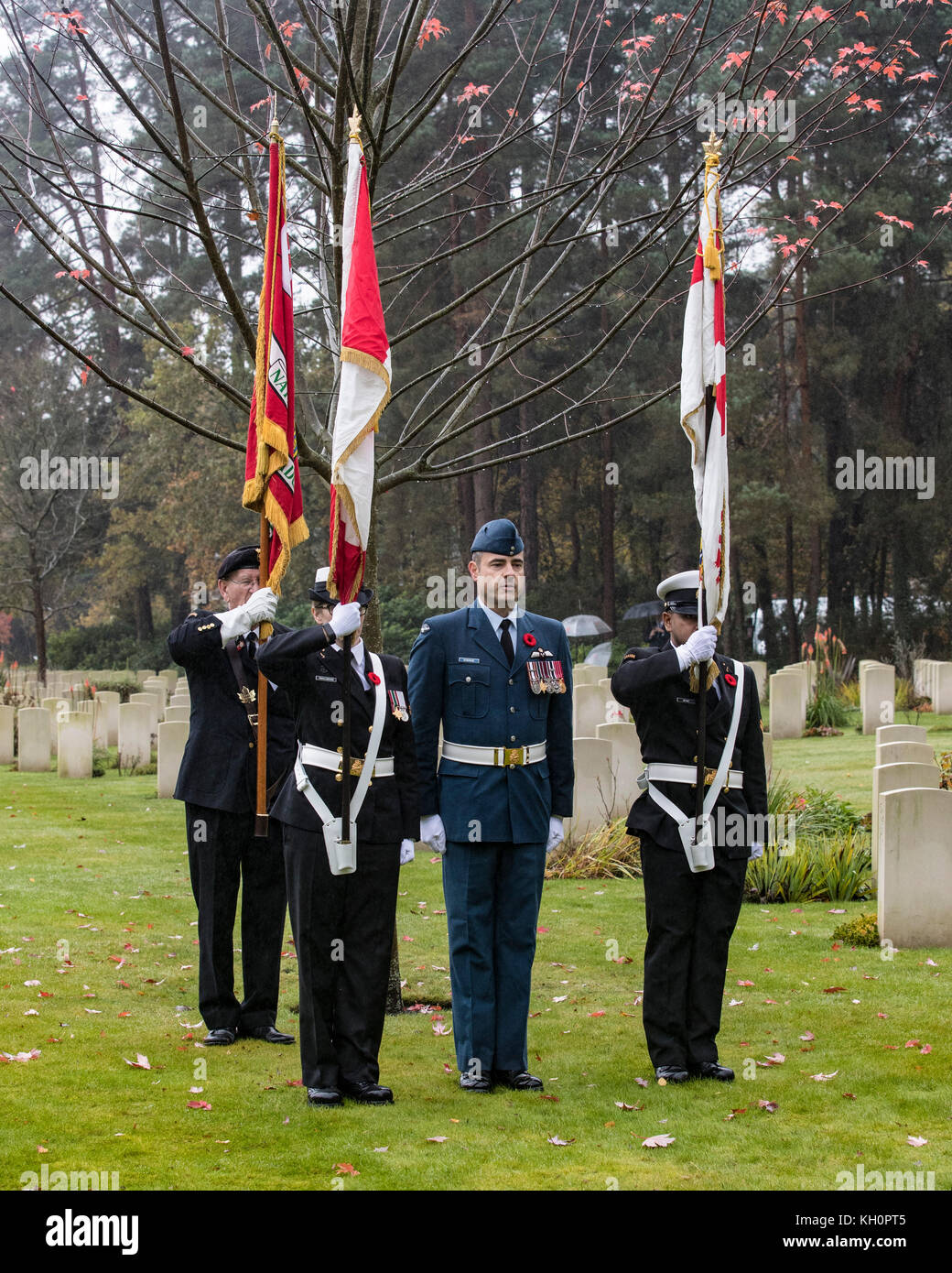 The Colour Party wait to commence the Canadian Service of Remembrance at Brookwood CWGC Cemetery in Surrey on Armistice Day Stock Photo