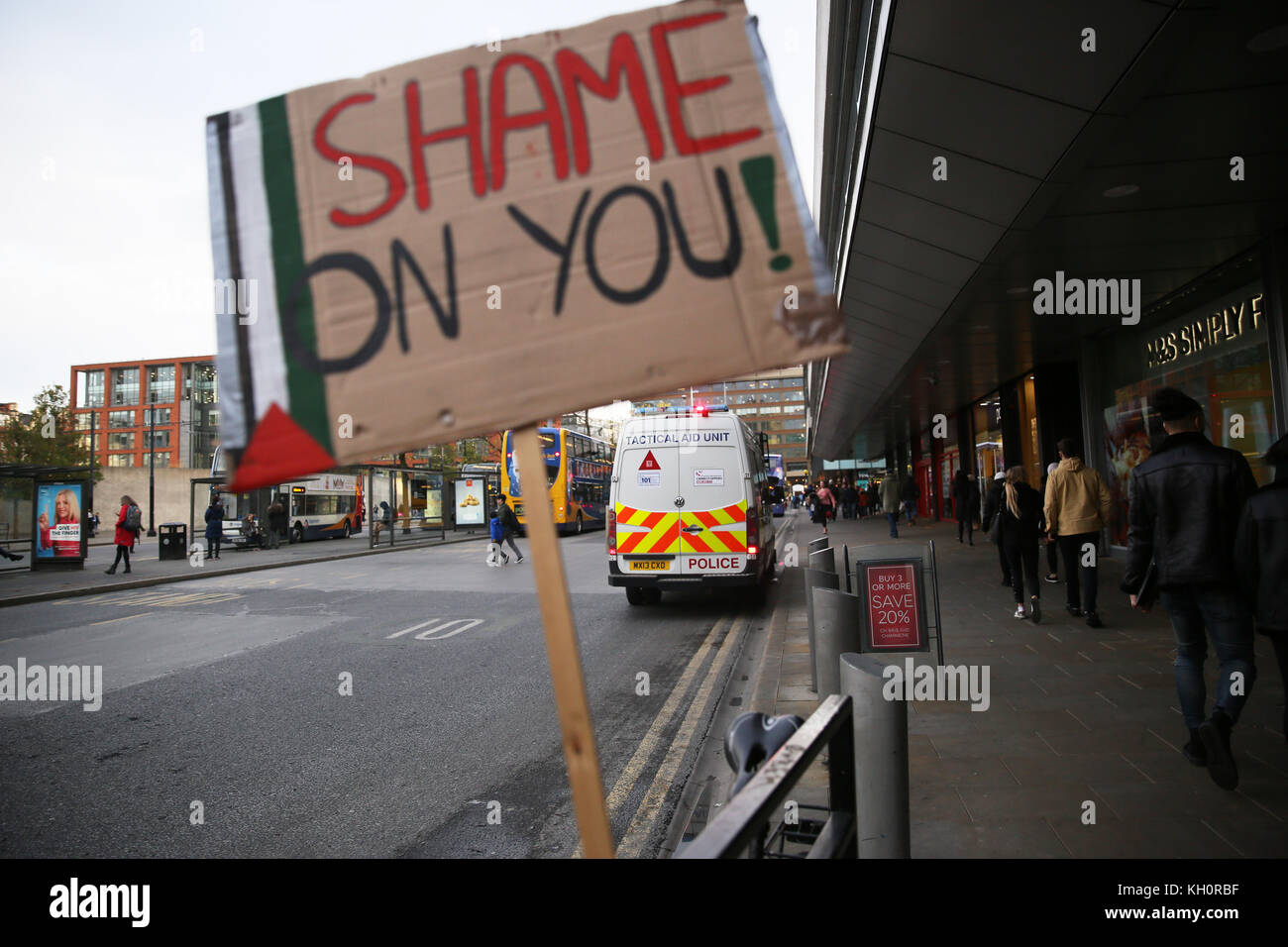 Manchester, UK. 11th Nov, 2017. A placard reading 'Shame On You' on railings with a Tactical Aid Unit van in the background, Manchester, 11th November, 2017 Credit: Barbara Cook/Alamy Live News Stock Photo