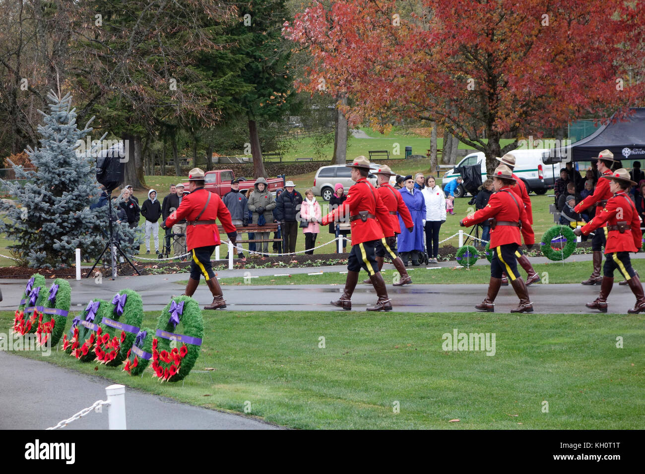 Burnaby, BC, Canada. 11th November, 2017. Members of the Burnaby Royal Canadian Mounted Police (RCMP) march into Confederation Park in their Red Serge uniforms, prior to the start of the Remembrance Day ceremony. Stock Photo