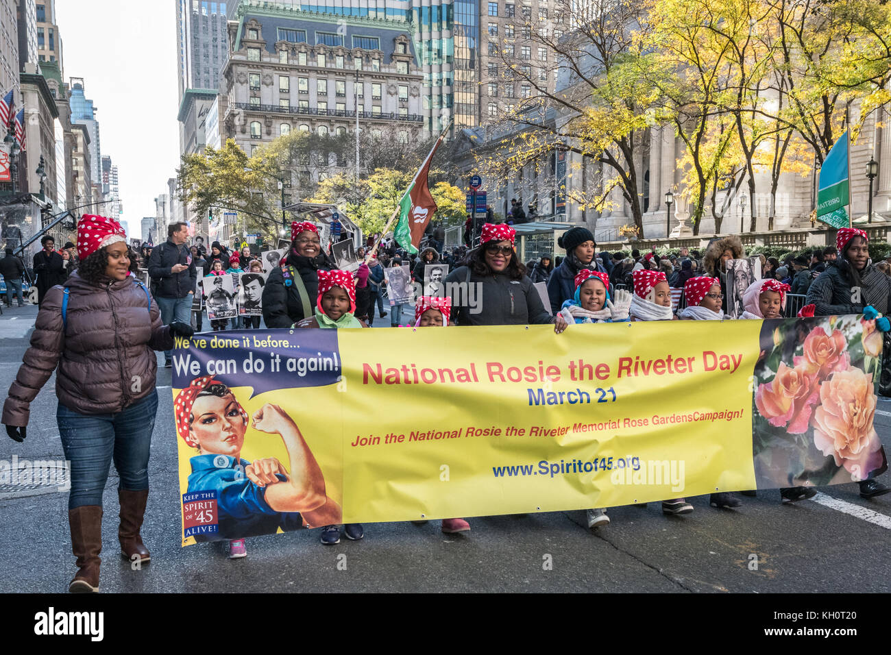 New York, USA, 11 Nov 2017.  Members of the 'Spirit of 45' organization wear headscarf honoring Rosie the Riveter as they march through New York's Fifth Avenue during the 2017 Veterans Day parade . Photo by Enrique Shore/Alamy Live News Stock Photo