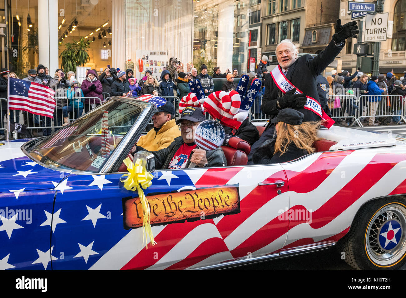 New York, USA, 11 Nov 2017. Former astronaut and US Air Force Korean War Veteran Buzz Aldrin waves to cheering crowds from a vintage cadillac at the start of the 2017 Veterans Day parade . Dr. Aldrin, one of the first two humans to walk on the Moon in 1969, was the Grand Marshal of the parade this year, Photo by Enrique Shore/Alamy Live News Stock Photo