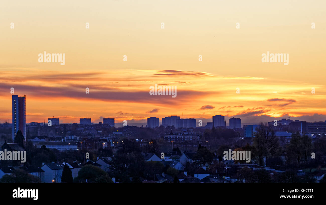 Glasgow, Scotland, UK  12th November. UK Weather Sunny morning ahead as the last of the cloud mushrooms as the sun rises on remembrance sunday. Credit Gerard Ferry/Alamy news Stock Photo