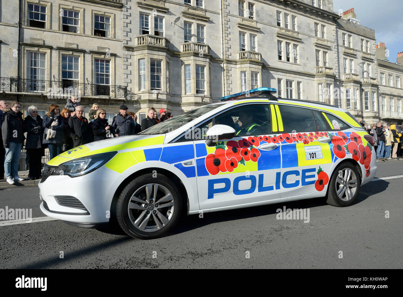 Poppy branded police car at Remembrance Day service, Weymouth, Dorset, UK Credit: Finnbarr Webster/Alamy Live News Stock Photo