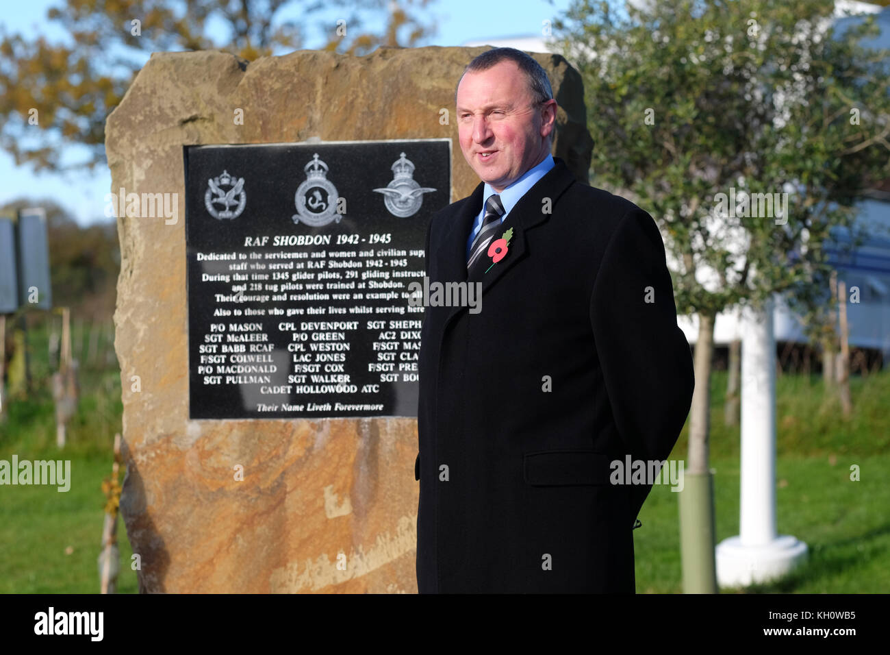 Shobdon airfield, Herefordshire, UK - Sunday 12th November 2017 - a member of the Herefordshire Aero Club pays respect on Remembrance Sunday at the airfield at Shobdon - the airfield was built in WW2 and used by the RAF to train glider assault pilots from the Glider Pilot Regiment in readiness for the invasion of Normandy D-Day and the glider assaults at Arnhem and across the Rhine.  Steven May / Alamy Live News Stock Photo