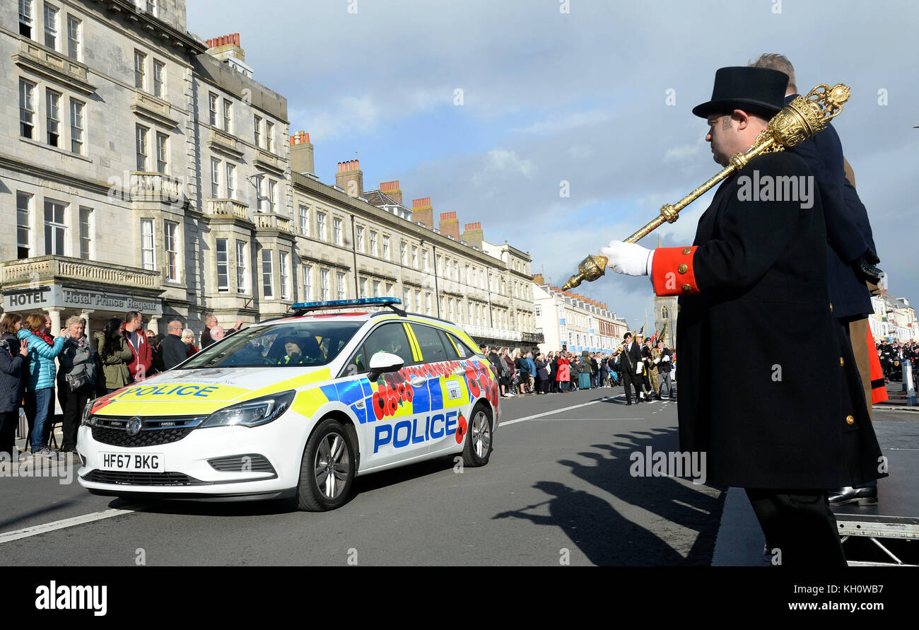 Poppy branded police car at Remembrance Day service, Weymouth, Dorset