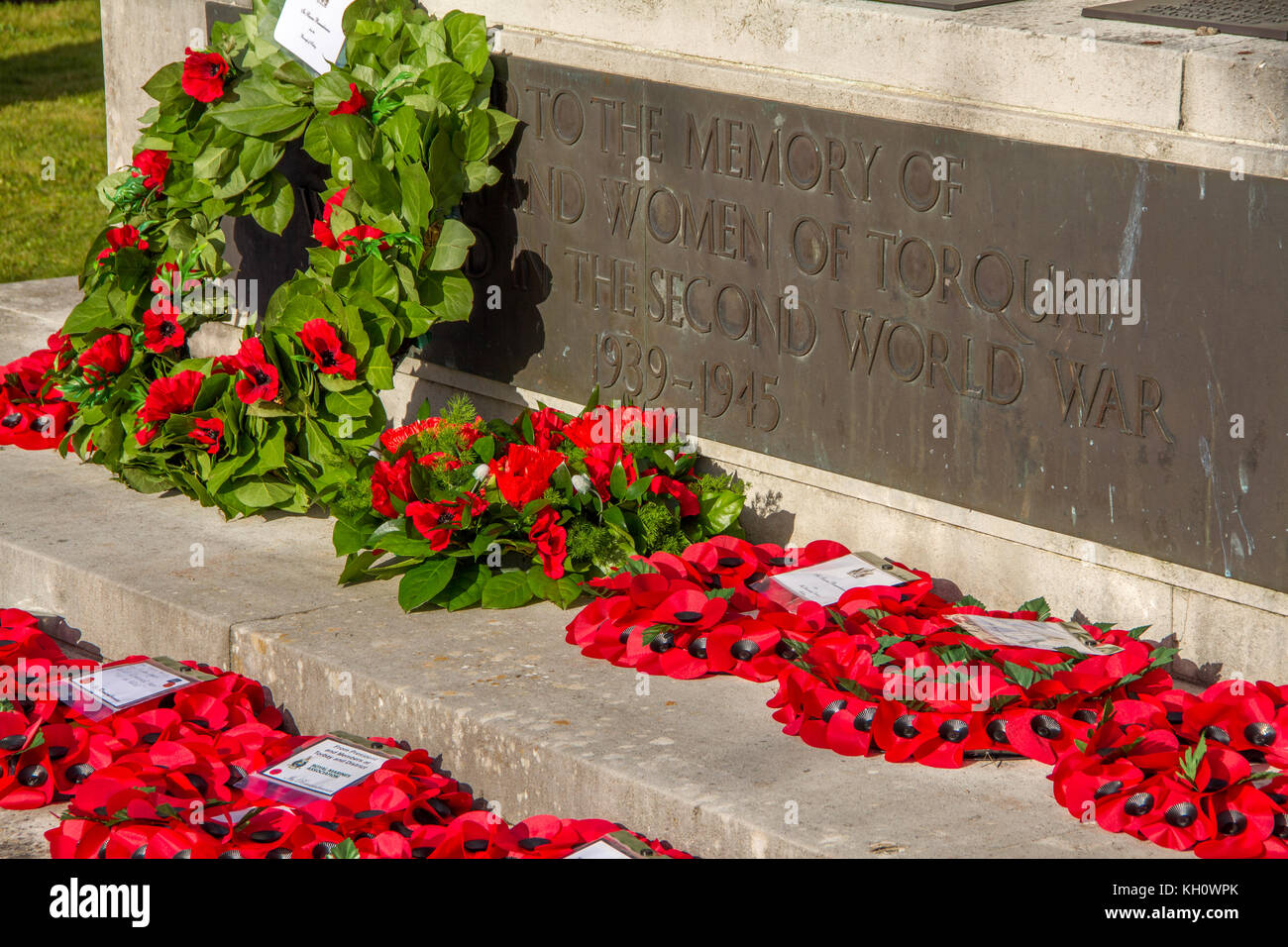 Poppies in wreaths lying on the Cenotaph war memorial at Torquay, laid during the Remembrance Sunday ceremony in Princess Gardens, Torquay, Devon, UK. 12th November 2017. Stock Photo