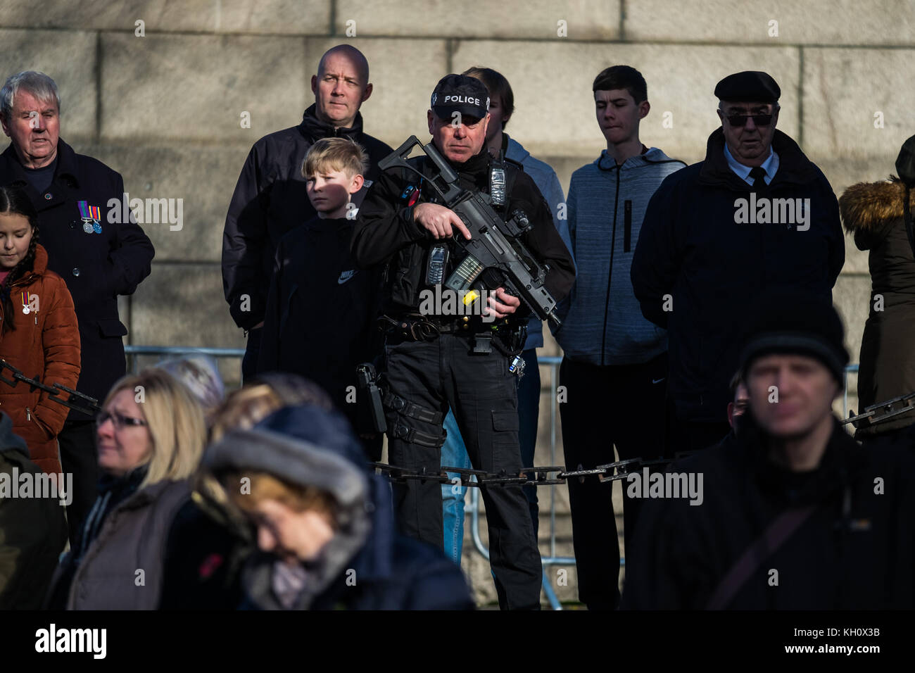 Liverpool, UK. 12th Nov, 2017. Armed Police watch over the Remembrance Sunday service in Liverpool as thousands of people attended a service at St George's Plateau cenotaph outside St George's Hall in Liverpool city centre on Sunday, November 12, 2017. Credit: Christopher Middleton/Alamy Live News Stock Photo