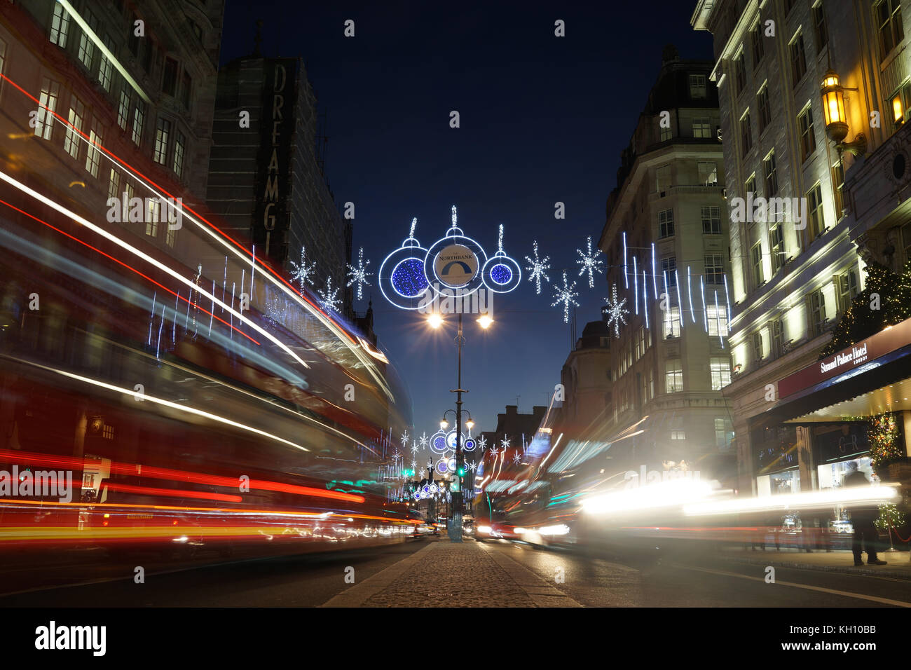 London, UK. 12th Nov, 2017. Buses pass under the Christmas lights on the Strand at dusk. Credit: Roland Phillips/Alamy Live News Stock Photo