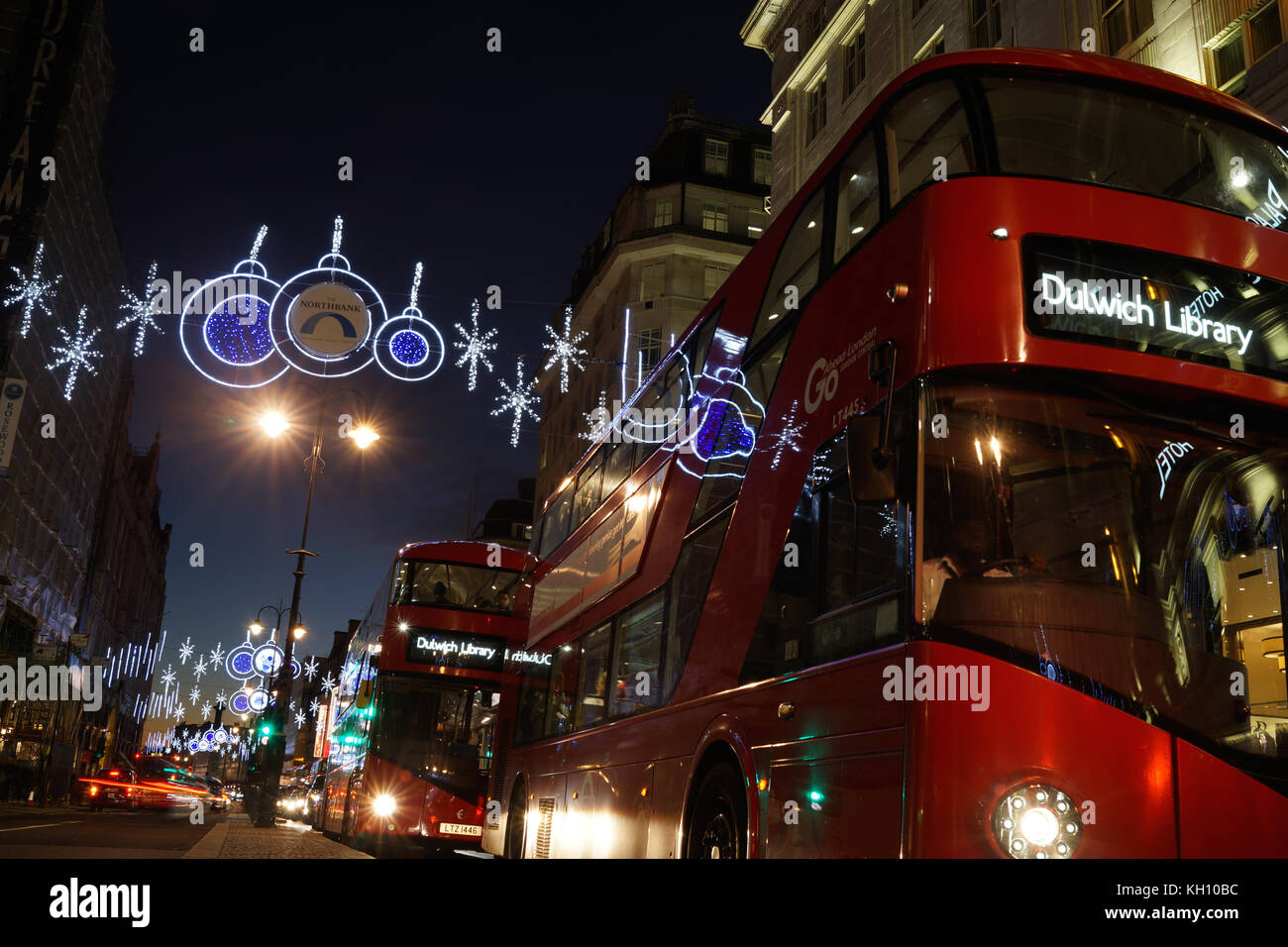 London, UK. 12th Nov, 2017. London buses catch the reflection of the Christmas lights on the Strand. Credit: Roland Phillips/Alamy Live News Stock Photo